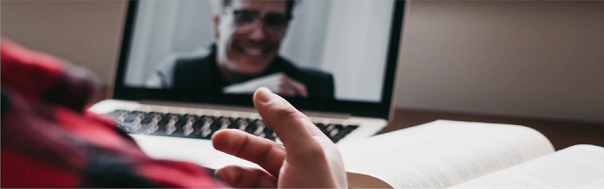 Person speaking to coworker on a video call