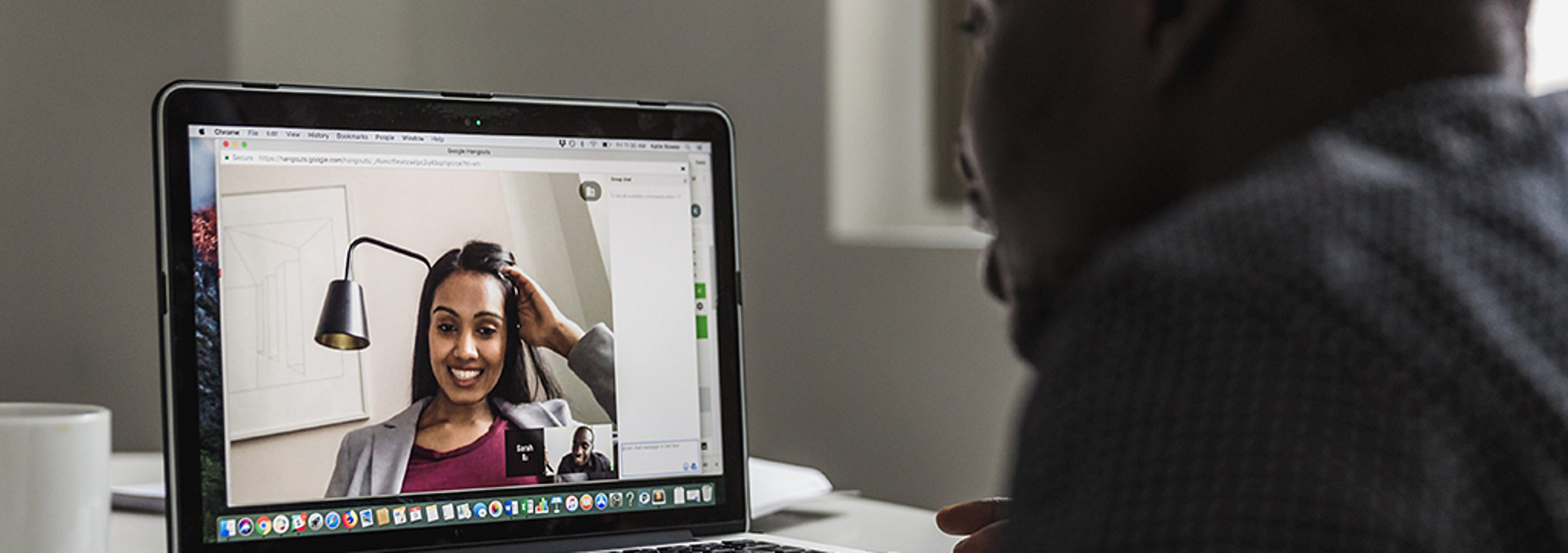 Hiring manager interviews a potential candidate using video chat from his home laptop