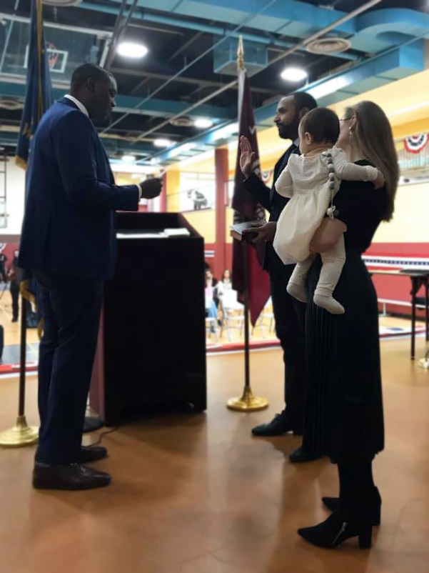 Omar Lopez gets sworn in as village trustee by Democratic congressional candidate Mondaire Jones.